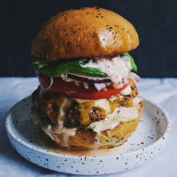 Cheeseburger with lettuce, cheese and tomato